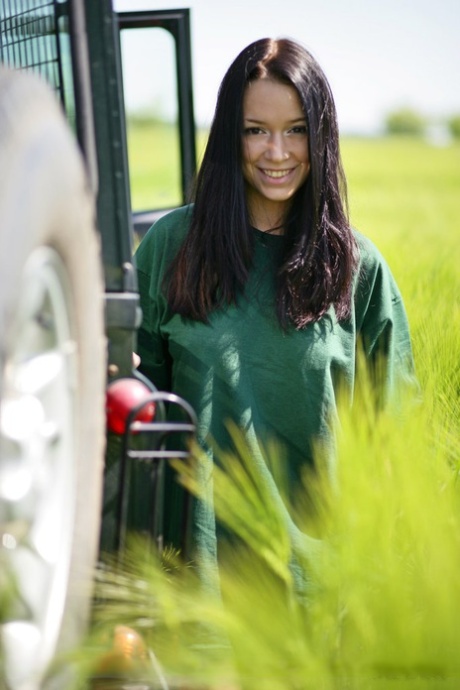 Dark haired girl Gwen A strips naked on top of a Land Rover on safari 37363921