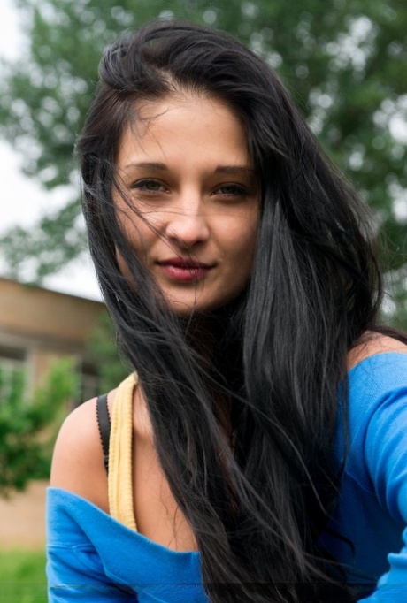 Dark haired teen Katya Ac shows her landing strip pussy while naked in a field 49986184