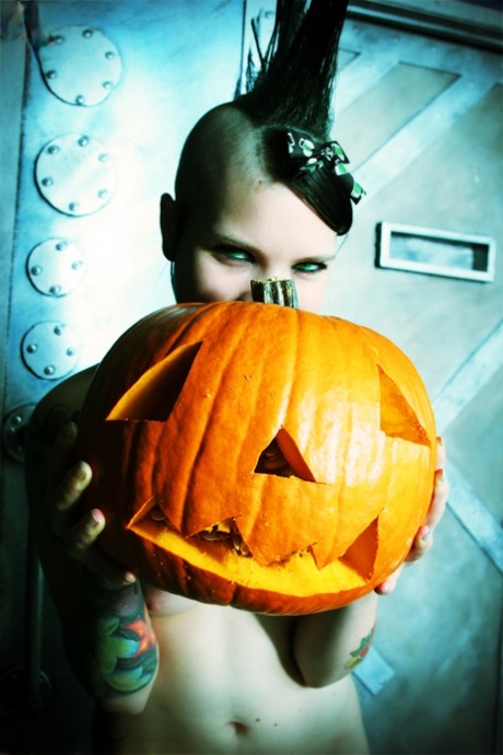 Alternative girl Tara Toxic carves a pumpkin in thigh highs and boots 30230297