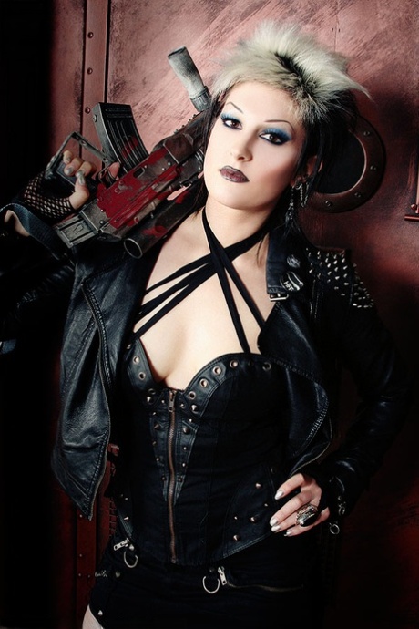 UK cyberpunk Alley Shiver wields an automatic rifle while showing her goods 55888831