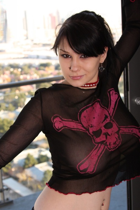 Goth girl Jennique Addams bares her pierced pussy after holding her great tits 66085165