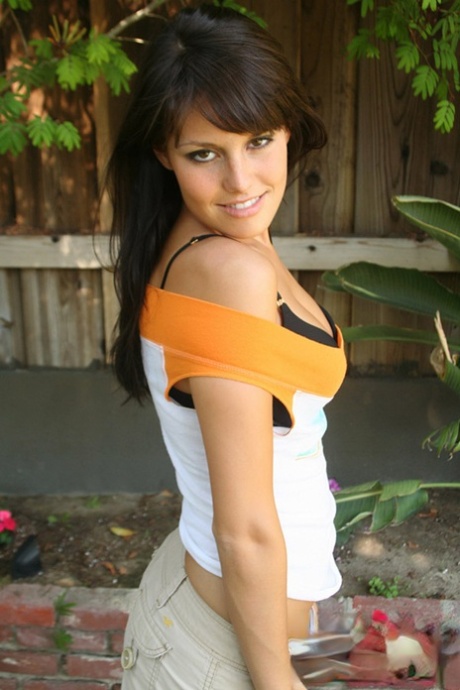 Clothed babe peels off her clothes to pose naked in the backyard 51546170