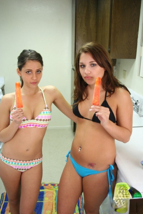 Teen lesbians Lili Jensen & Cali Logan lick frozen treats and nipples 52373101