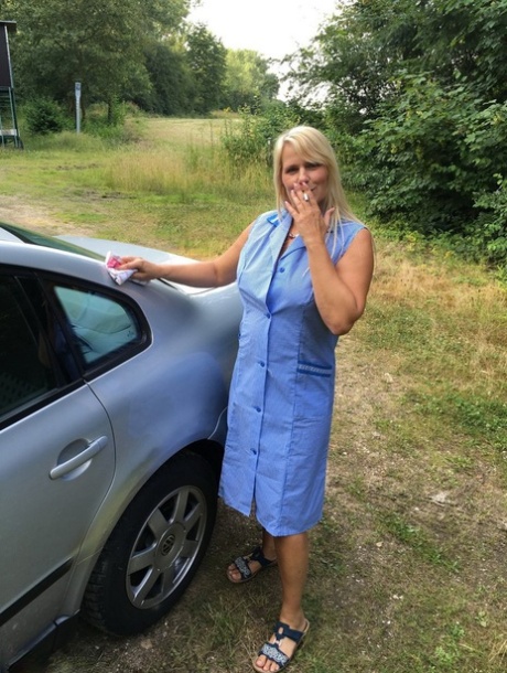 Smoking mature mom Sweet Susi opens her dress to pinch hard nipples outdoors 90963597