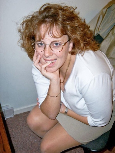 Mature redhead Curvyclaire dons thigh high boots after stripping to lingerie 56365938
