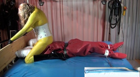 Lesbian women indulge in kinky bondage sex while wearing rubber apparel 42442899