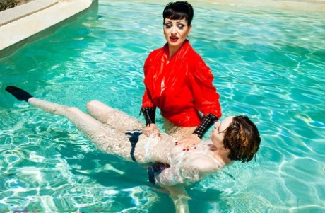 Hot girl is subjected to breath play during lezdom games in a swimming pool 63655075