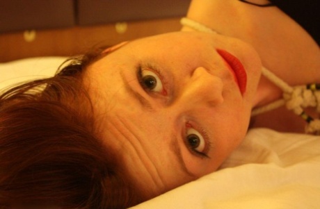 Redheaded chick is tied up in her clothing on a bed by her lesbian lover 23288249