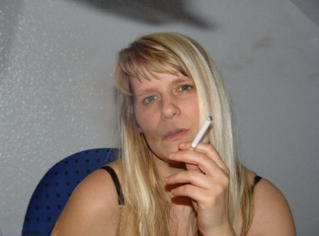 Mature amateur smokes a cigarette before masturbating in office chair 90559321