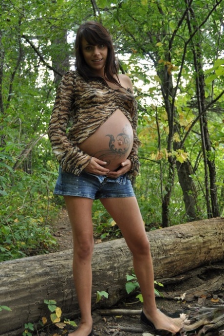 Pregnant amateur Brianna shows tits and twat plus swollen belly in the woods 95030928