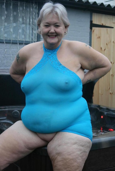 Fat granny hikes up see thru dress to expose her vagina in black pumps 60458035