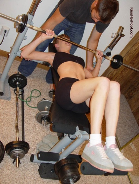 Physically fit girl has her white socks removed before foot worshiping action 75110325