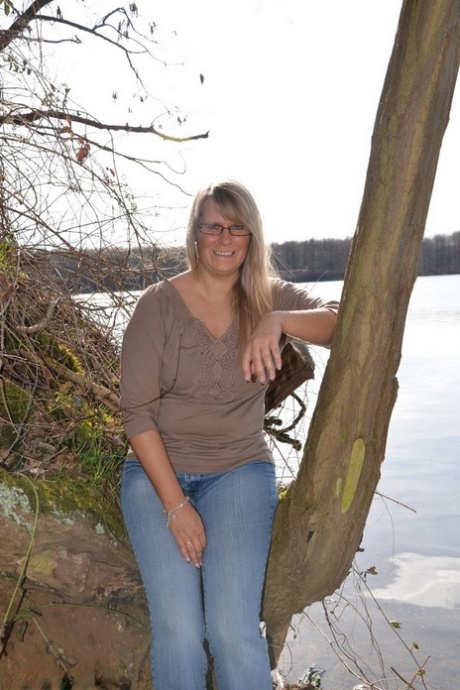 Overweight amateur Sweet Susi wears her glasses while getting naked by a river 61558947