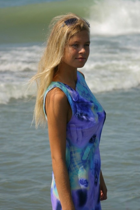 Natural blonde teen makes her nude debut while searching for shells at the sea 76131307