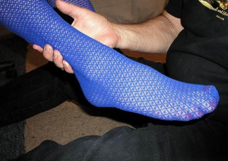Caucasian woman has her high heels removed by a subservient man 82647494