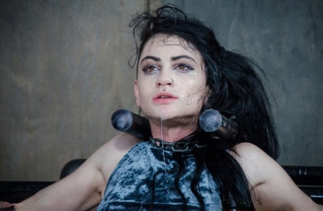 Dark haired chick Lydia Black endures facial abuse while restrained in dungeon 96797396