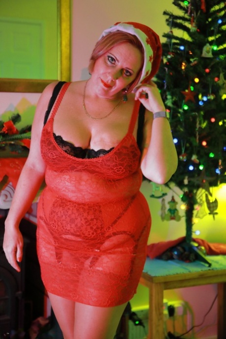 British BBW Curvy Claire models lingerie and boots in a Christmas cap 95229728