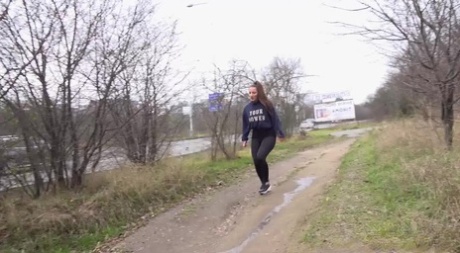 Brunette teen Nicolette Noir takes a badly needed piss on a dirt path 74932607