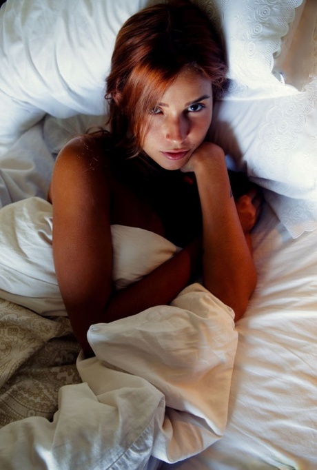 Natural redhead Agatha Vega holds her pigtails while totally naked 83847160