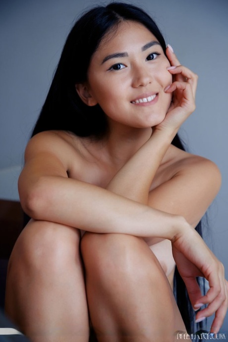Young Asian beauty Kimiko gets completely naked on a set of stairs 40038151