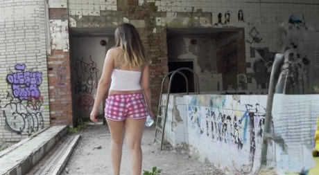 Diana chugs a bottle of water prior to taking a pee at an abandoned site 31001557