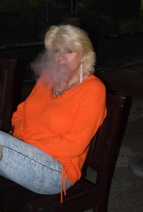 Older blonde Dimonty gets naked on a chair while wearing over the knee boots 23148648