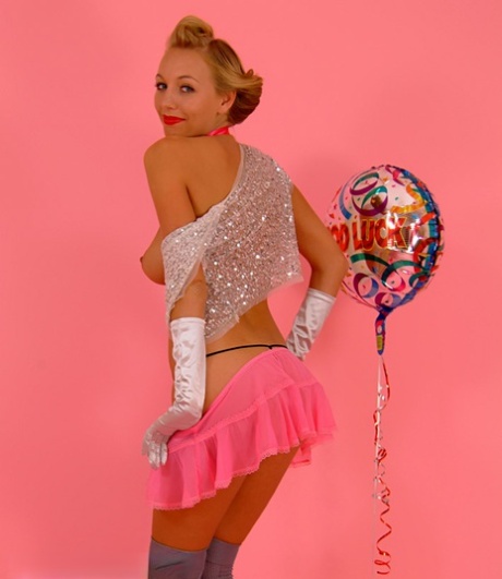 Pinup girl Marie Coppin puts her pert tits on display in a thong and OTK socks 41131325