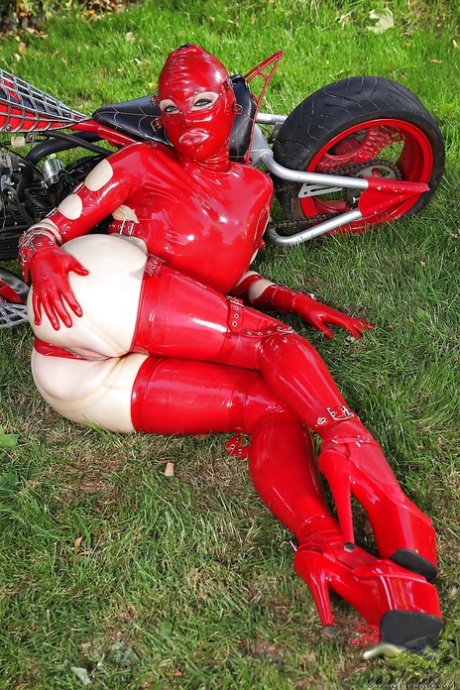 Voluptuous fetish vixen in latex suit revealing her juicy cunt outdoor 83428808
