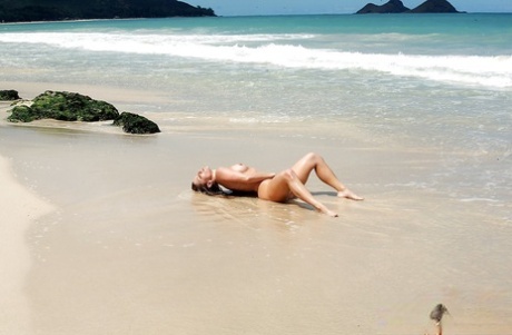 Hot blonde first timer Ashley Fires spreading long legs outdoors in ocean 22784414