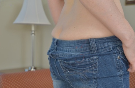 Dark haired solo girl Stacy Ray poses in jeans before unveiling large boobs
