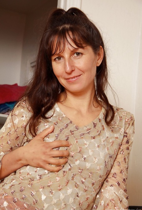 Sexy mature lady with tiny tits Carmen taking off her clothes 99169635