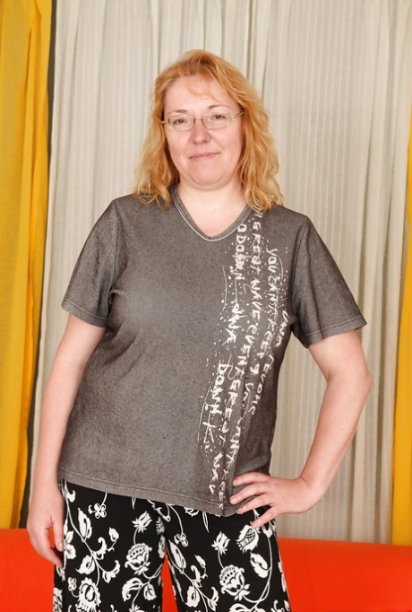 Chubby redhead mature gal with big flabby jugs getting naked 56693771