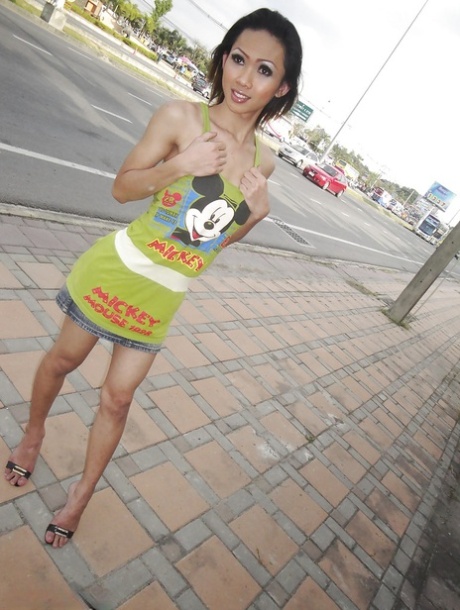 Tiny Asian tranny teen Poppy showing off her long legs outdoors 50150479